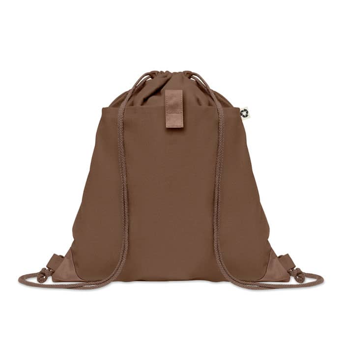 A brown drawstring bag with adjustable straps and a small logo feature.
