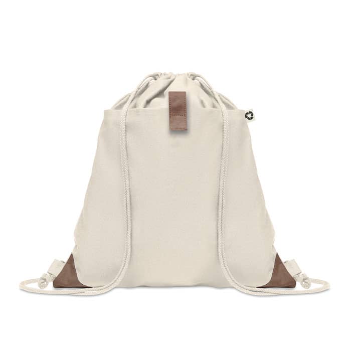 A drawstring bag in light beige with brown leather accents and a logo at the top.