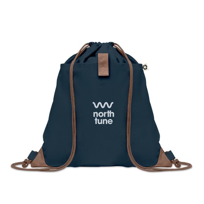 A navy drawstring bag with a brown base and a logo on the front. Features adjustable straps for carrying.
