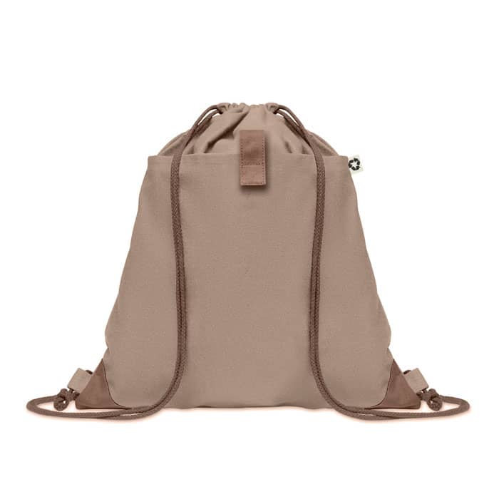 A tan drawstring backpack with matching straps and a small logo. Simple and functional design.