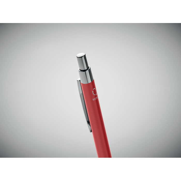 A red pen with chrome accents and a clip, featuring a branding logo on the barrel.