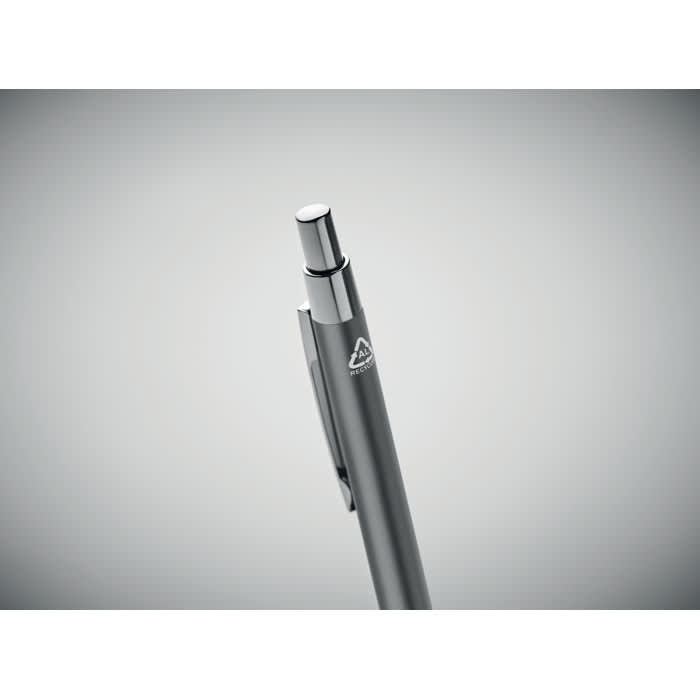 A pen with a sleek silver body and a chrome push button, featuring a logo on the side.