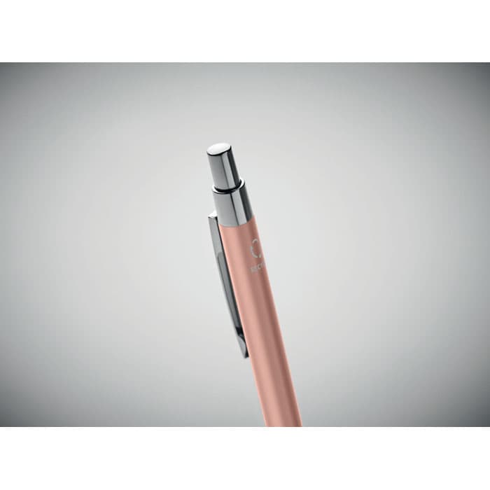 A pen with a sleek pink barrel and chrome accents, featuring a clip and a shiny nib.