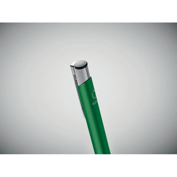 A green pen with a silver clip, featuring a branding logo on its side.
