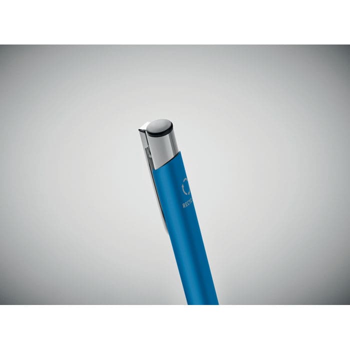 A blue pen with a metallic clip and a logo on its barrel, angled for a close-up view.