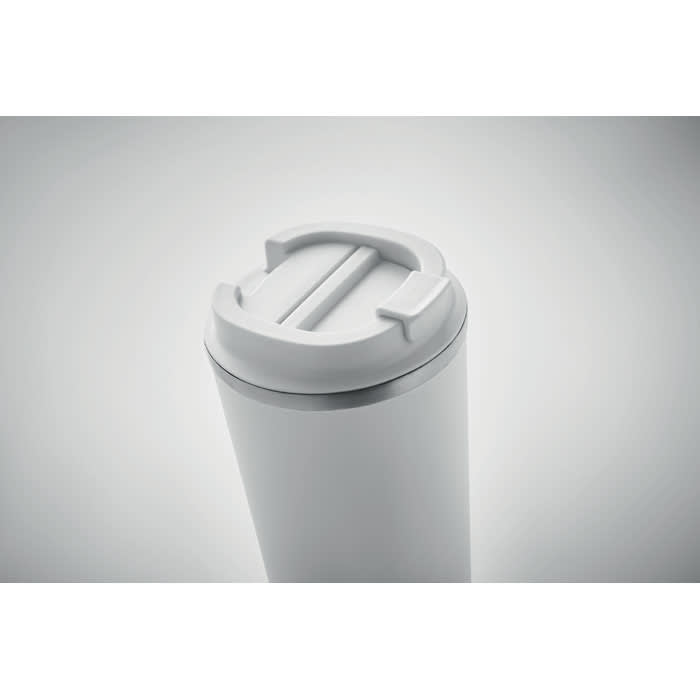 A drink bottle in white with a grey lid featuring a spout and a secure closure. It has a minimalist design.