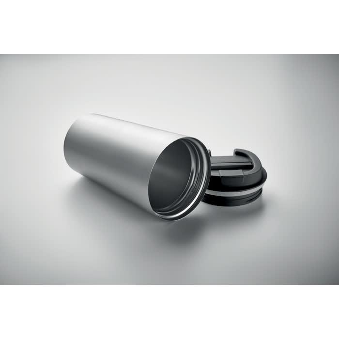 A silver drink bottle with a black cap, positioned on its side against a plain background.