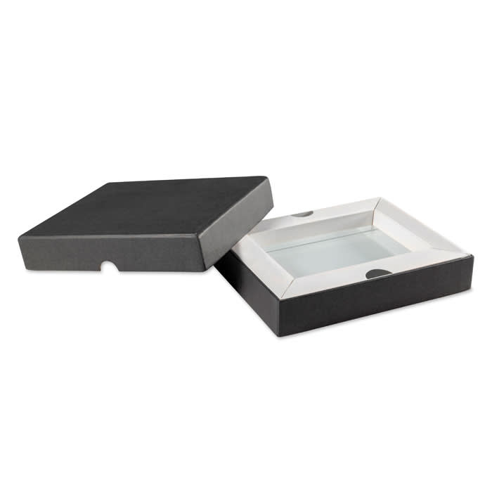 A gift box in a two-tone design, featuring a crisp white interior and a sleek black exterior, partially open.