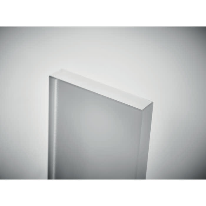 A clear, rectangular glass block with smooth edges, set against a neutral background.