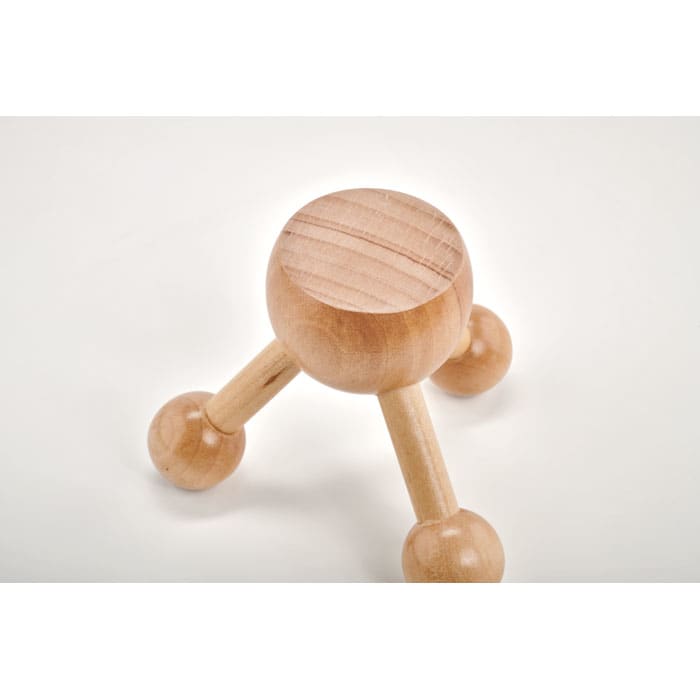 A wooden massage tool with a rounded top and three legs, each ending in a spherical shape.