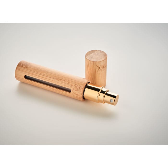 A drink bottle with a bamboo exterior, gold accents, and a removable cap, featuring a small window.