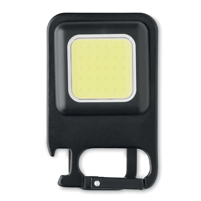 A portable LED light in black with a square light panel, featuring a built-in bottle opener and a logo.