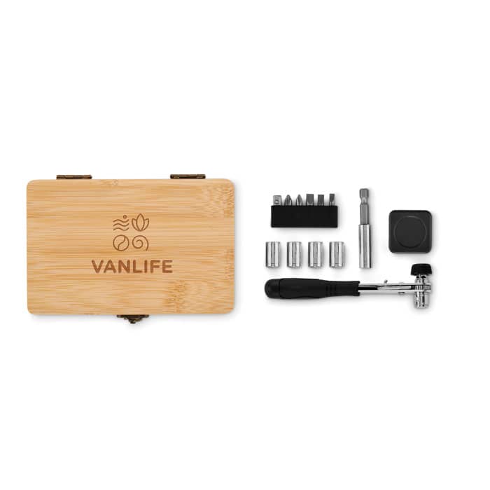 A bamboo box containing a tool kit with various bits, sockets, and a ratchet handle, featuring a logo on the lid.