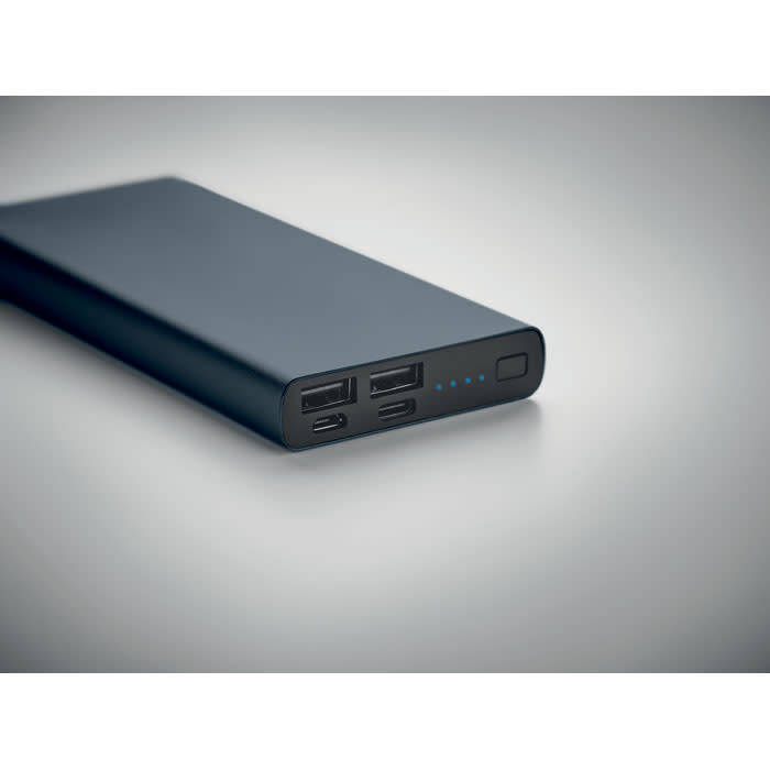 A power bank in sleek black with multiple USB ports and an indicator light. It has a minimalist design.