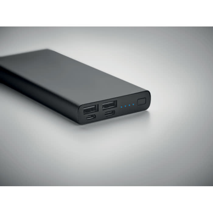 A power bank in black with multiple USB ports and a battery level indicator.