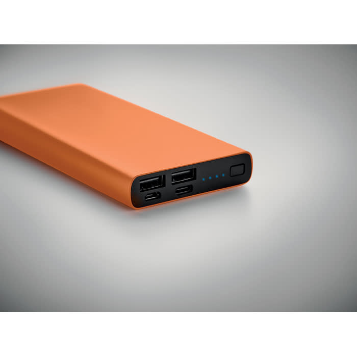 An orange power bank with two USB ports and a power button, featuring a sleek, minimalist design.