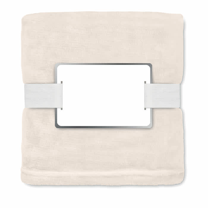 A soft beige blanket with a white band and rectangular holder in the centre, featuring no visible branding.