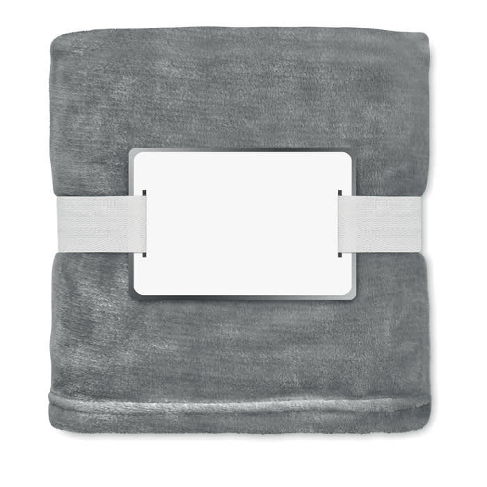 A grey blanket neatly folded and secured with a white band. It has a blank label on the front.
