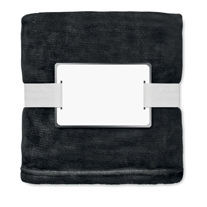 A plush black blanket neatly folded and secured with a white strap, featuring a blank label.