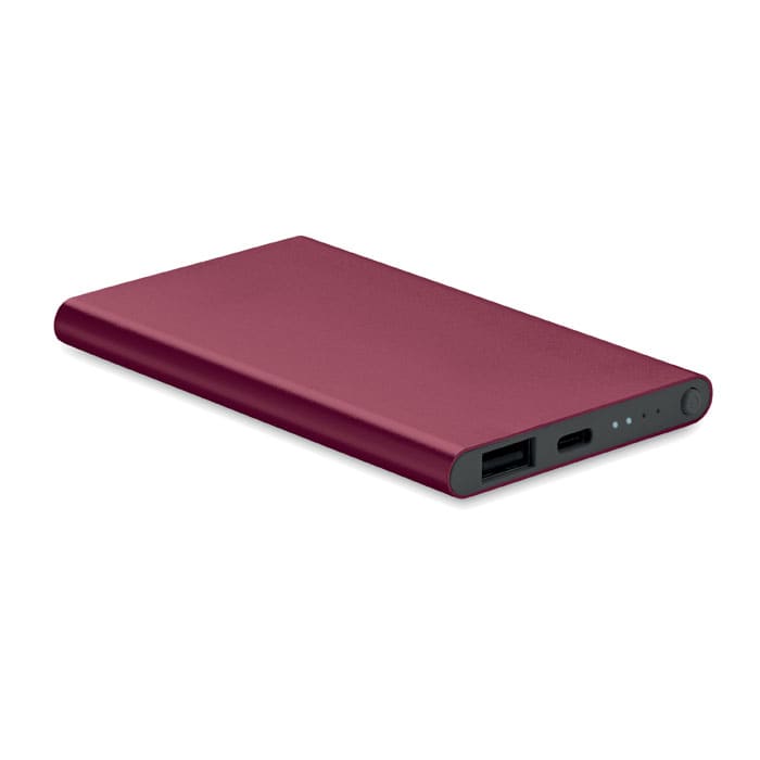 A power bank in a maroon finish, featuring USB ports and a sleek, slim design.