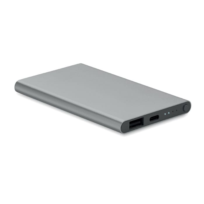 A power bank in sleek grey, featuring USB ports and indicator lights, with a minimalist design.