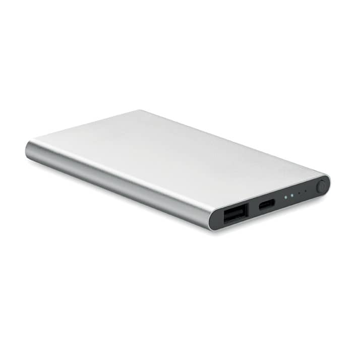 A power bank with a sleek silver design, featuring USB ports and charge indicators.
