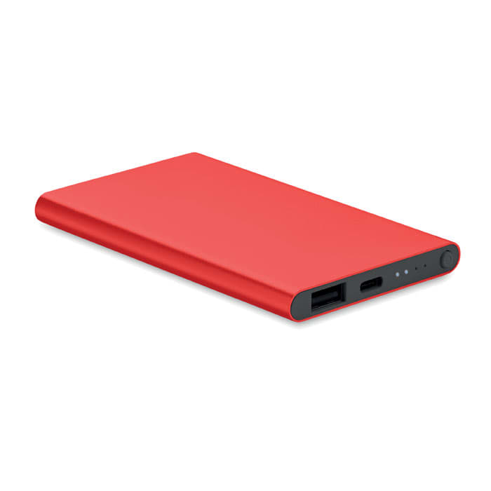 A power bank in bright red with a smooth exterior, featuring charging ports and an indicator light.