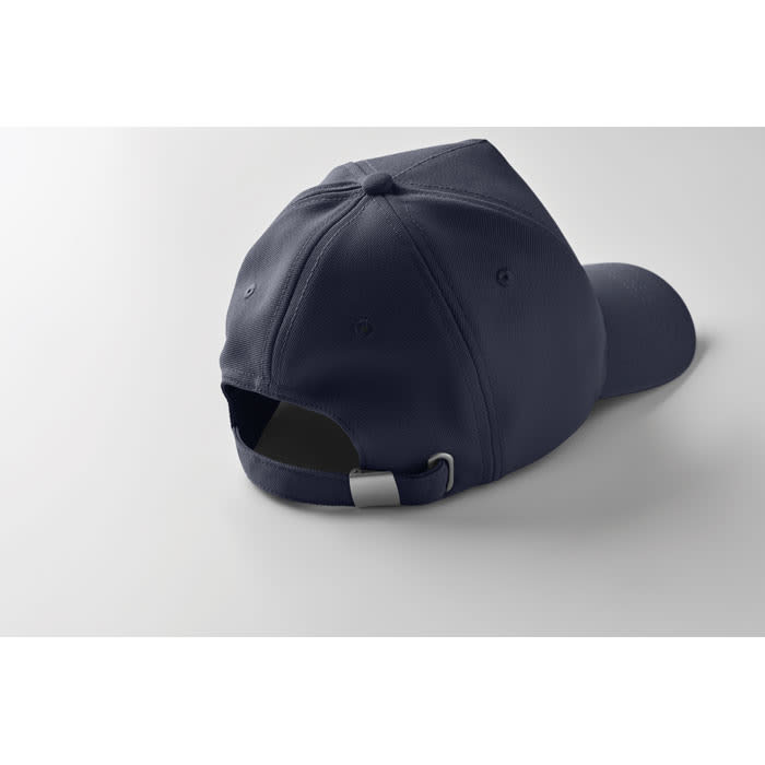 A navy blue cap featuring a curved brim and an adjustable strap at the back. It has a logo on the side.