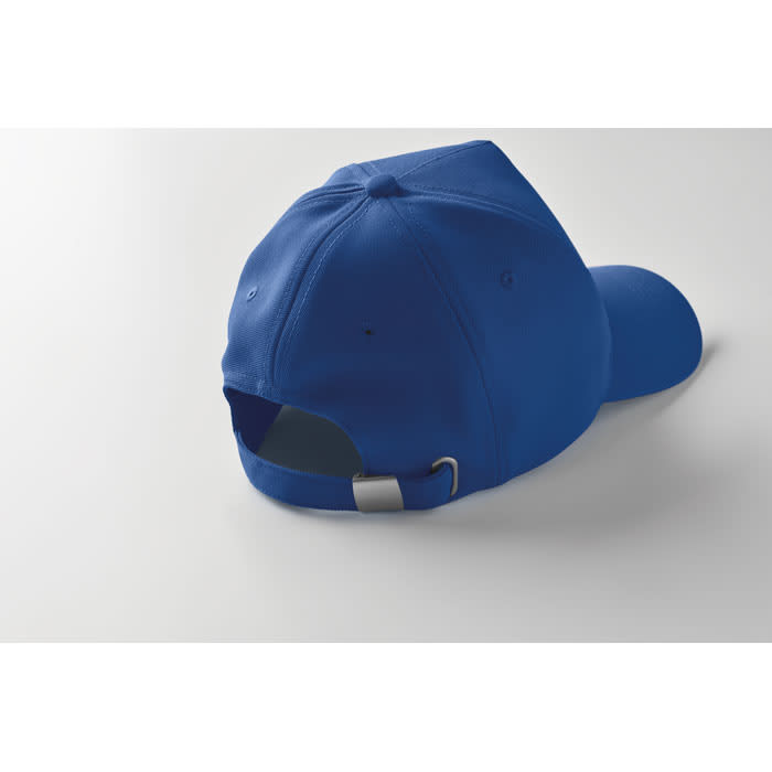 A blue cap featuring a curved peak and an adjustable strap at the back. It has a logo on the side.