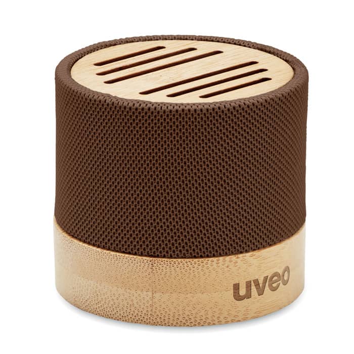 A brown speaker with a bamboo base and a textured mesh covering, featuring a logo.