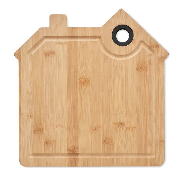 A bamboo cutting board shaped like a house, featuring a hole for hanging. It's natural wood in colour.