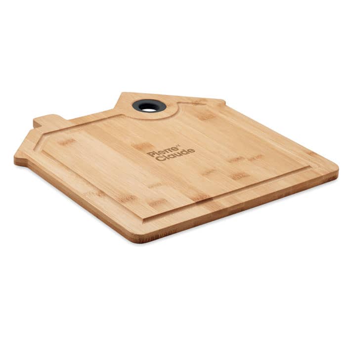 A bamboo chopping board in a house shape, featuring a hole for hanging and a branding logo.