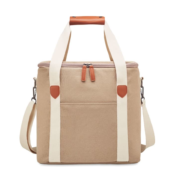 A beige lunch bag with a zip closure, featuring cream straps and a front pocket, also has a handle and a branding logo.