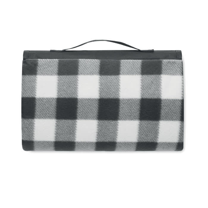 A picnic blanket in a black and white checkered pattern, featuring a handle for easy carrying.