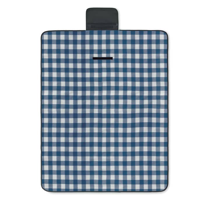 A picnic blanket featuring a blue and white checkered pattern with a black carry handle. It has a logo on one side.