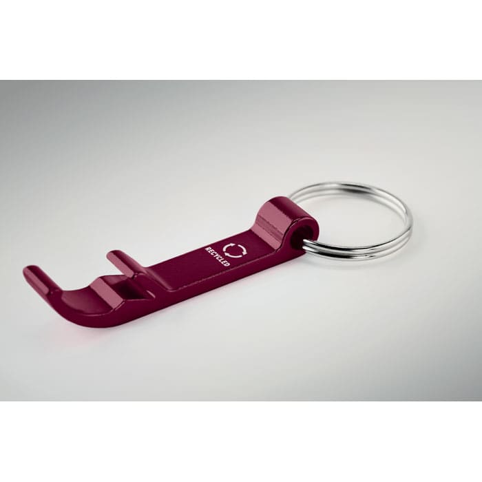 A maroon keychain multitool with a bottle opener and a metal ring. The product features a logo.