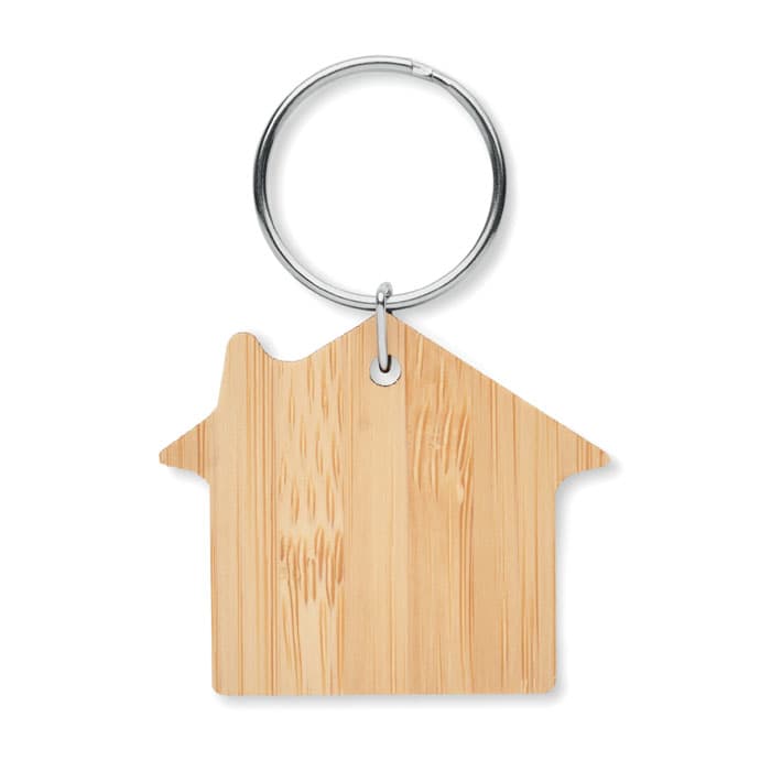 A keyring shaped like a house, made of bamboo with a silver metal loop.