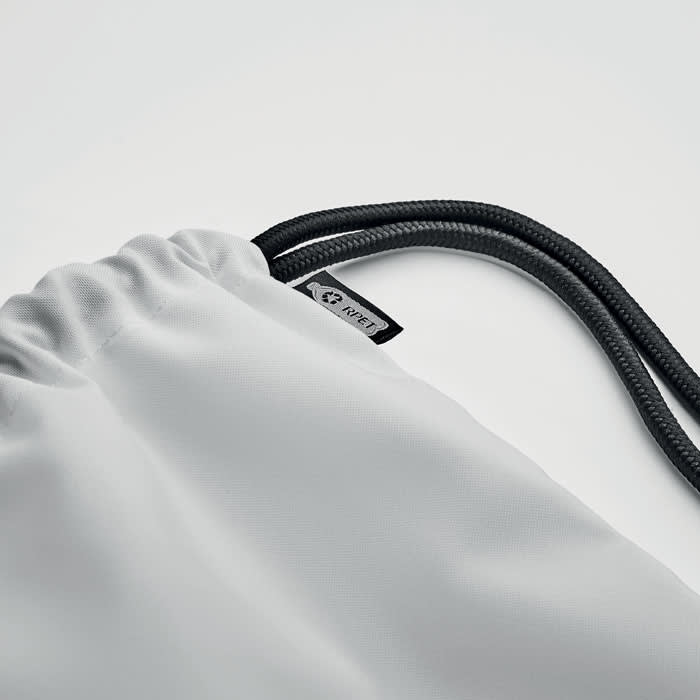 A drawstring bag in light grey with black cords, featuring a small logo tag.