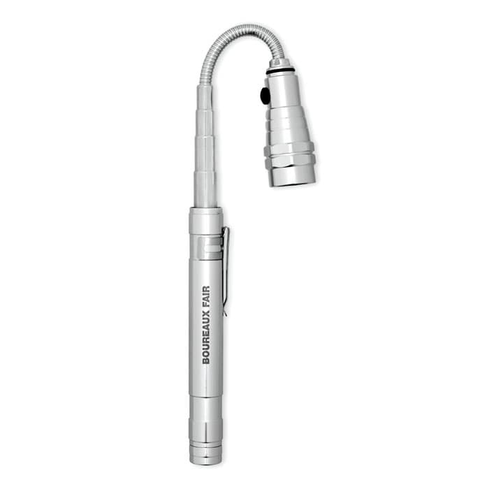 A silver flexible torch with a pen-like design and a clip, featuring a light at one end and a branding logo.