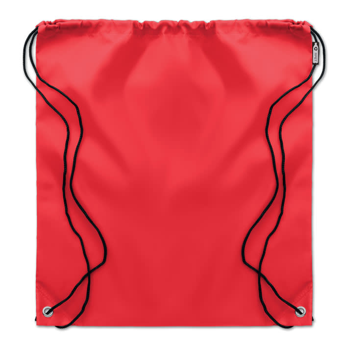 A drawstring bag in vibrant red with black cords and a logo on the front.