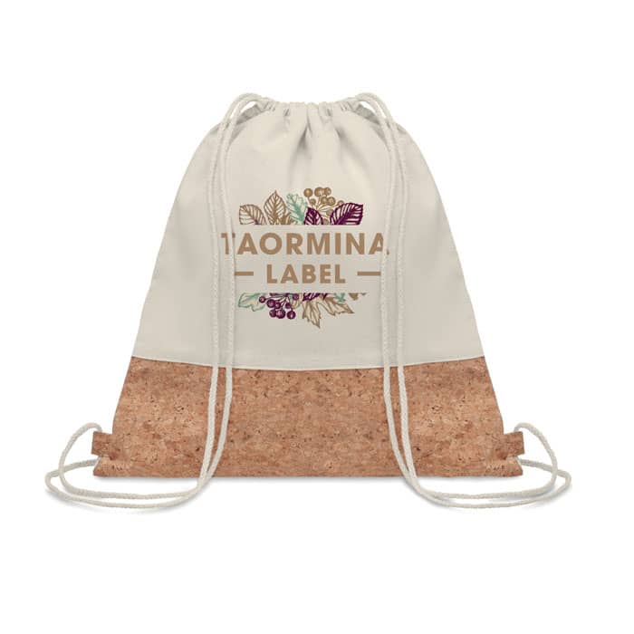 A drawstring backpack featuring a natural cork bottom and a cream fabric top with a floral design and logo.