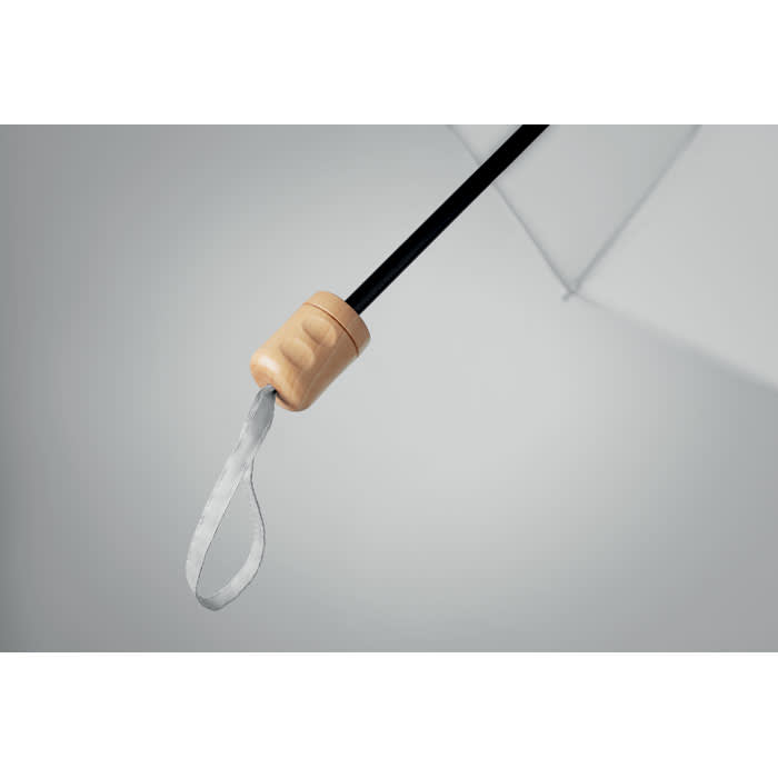 A close-up of a black umbrella handle with a wooden grip and a silver loop attached.