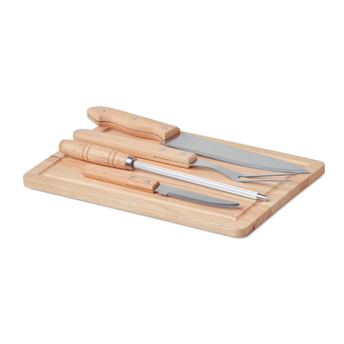 A set of kitchen knives and tools on a wooden cutting board, featuring wooden handles and stainless steel blades.