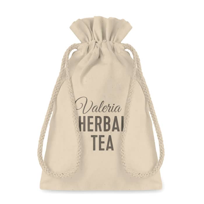 A beige drawstring bag with a logo and text, designed for herbal tea. The bag has a rope closure.