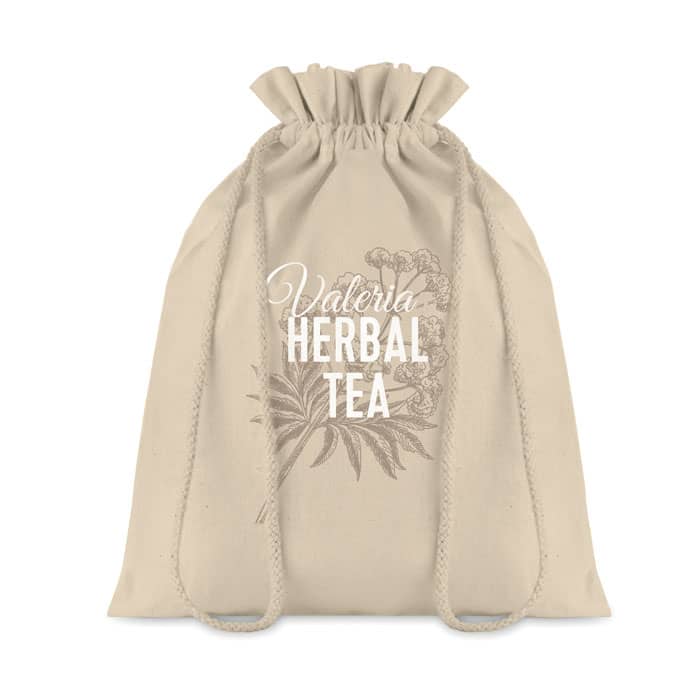 A beige drawstring bag with floral design and text, featuring a logo.