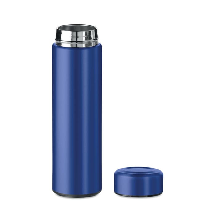 A drink bottle in a deep blue colour with a metallic silver lid and a removable cap. It features a logo.