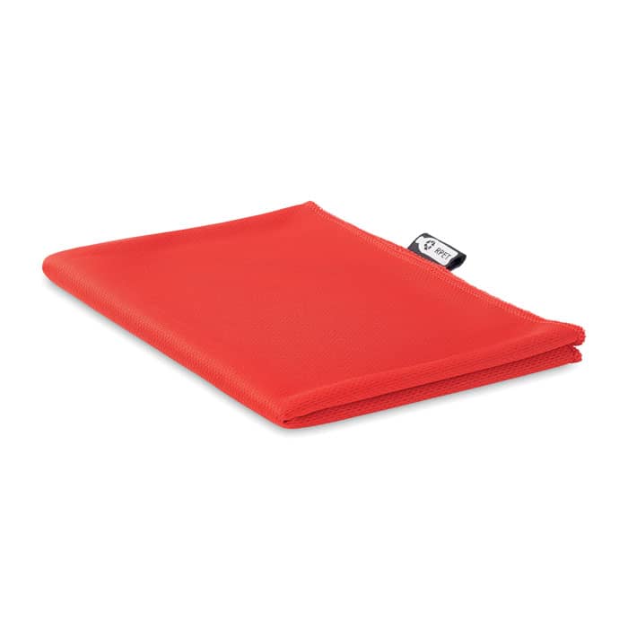 A red, foldable promotional product with a smooth texture, featuring a logo tag.