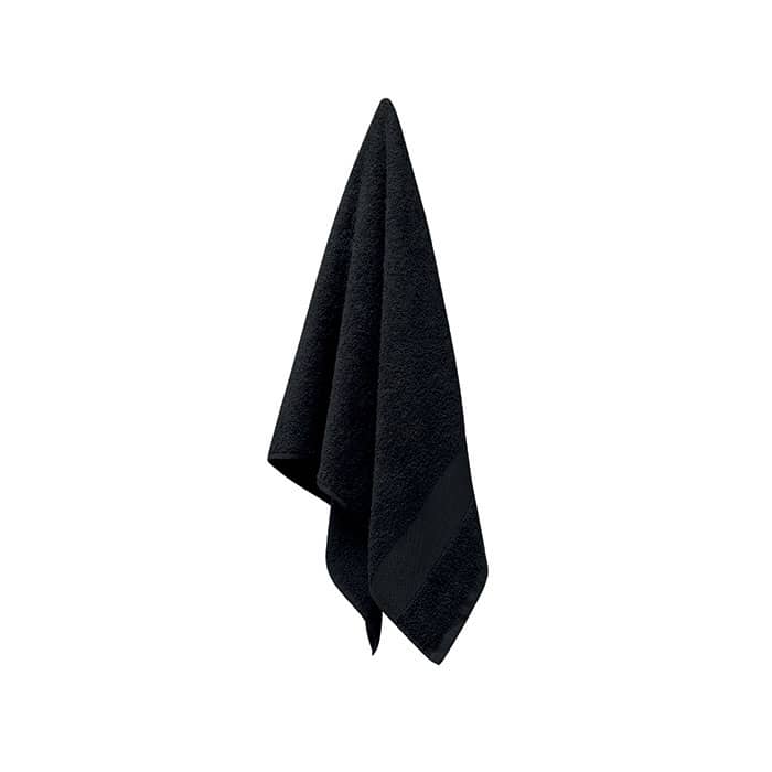 A black towel hanging down, featuring a textured surface and a neat fold at the bottom. It includes a logo.