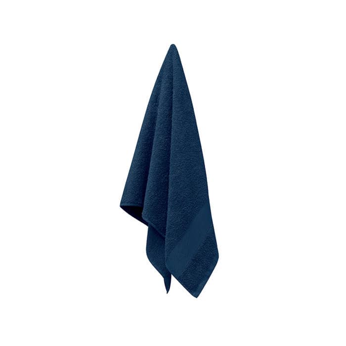 A navy blue towel hanging, featuring a textured surface and a folded edge. The towel has a subtle branding logo.