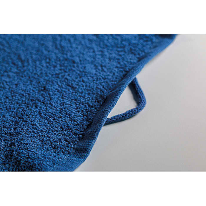 A blue terry cloth item featuring a loop for hanging. The texture appears soft and fluffy.
